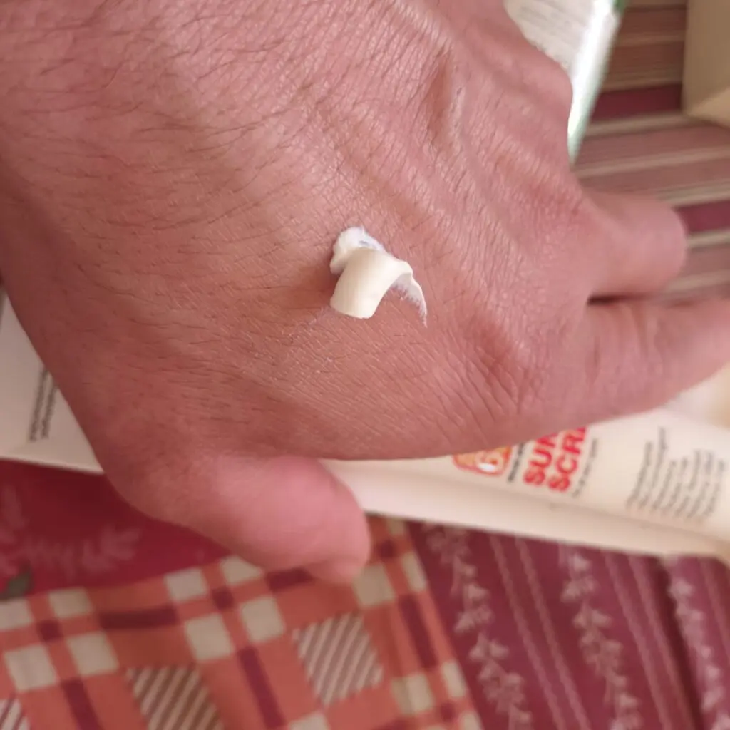 showing creamy texture of conatural sunscreen on back of the hand