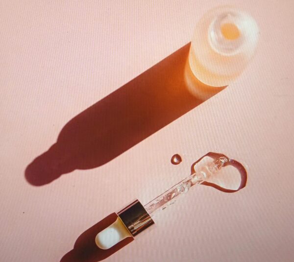 Azelaic acid serum bottle with drops for skincare