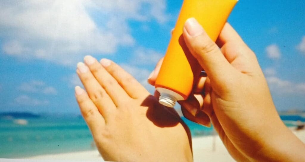 applying sunscreen on hands